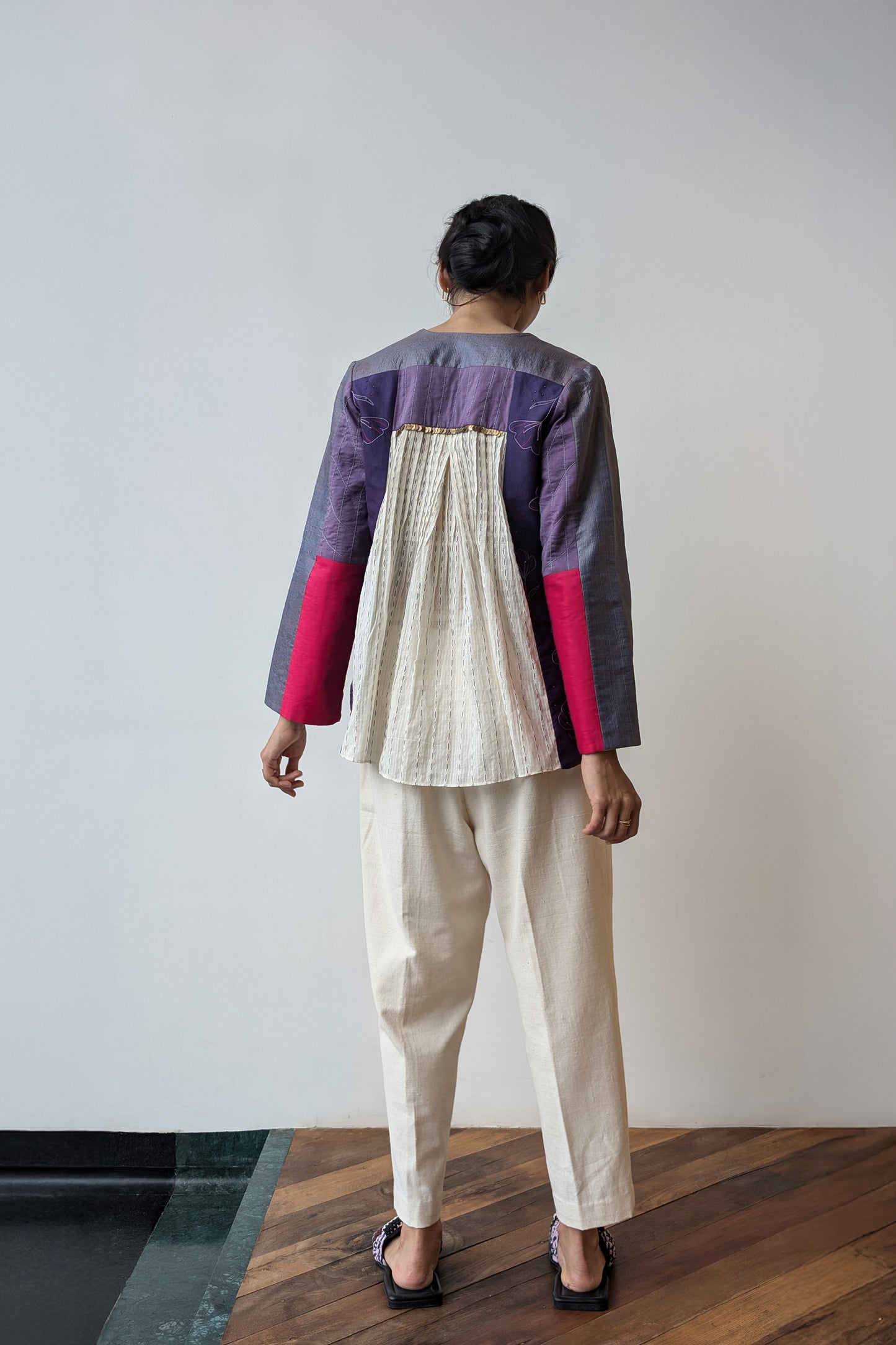 Person wearing a upcycled reversible, colorful outfit with a white background for Diwali & festive occasions.
