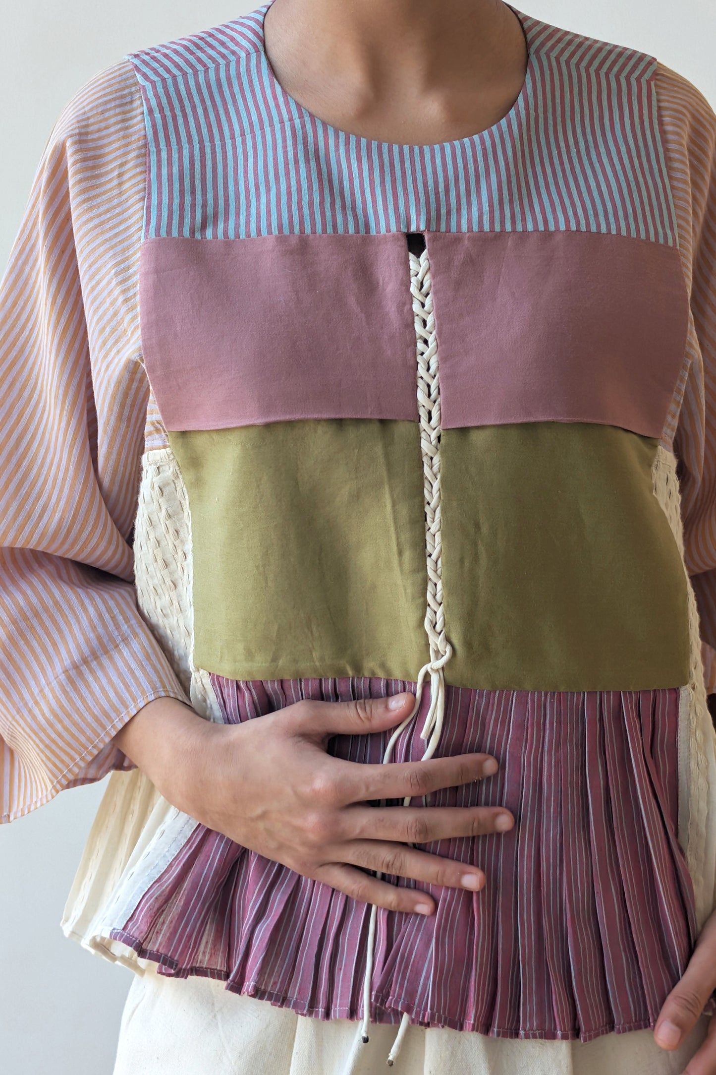 Person wearing a reversible colorful top for Diwali & festive occasions.