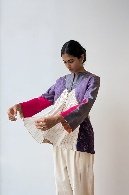 Woman wearing a upcycled reversible festive outfit with a white background for Diwali & festive occasions.