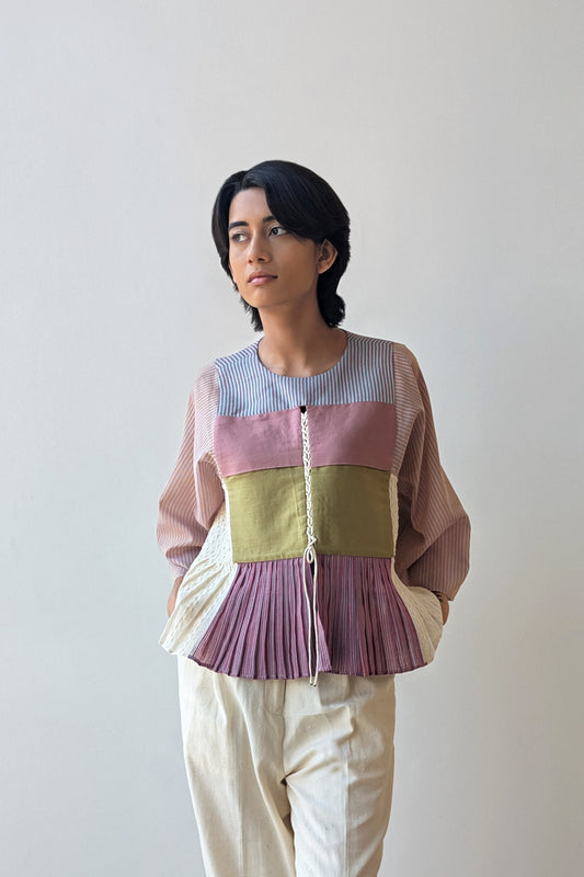 Person wearing a reversible colorful striped shirt with a plain background for Diwali & festive occasions.